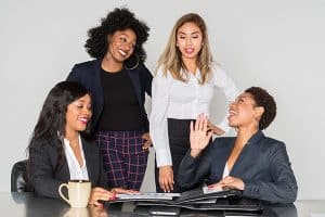 A cheerful business women having a discussion in the office