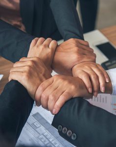 Diverse group of people joining hands, Teamwork concept
